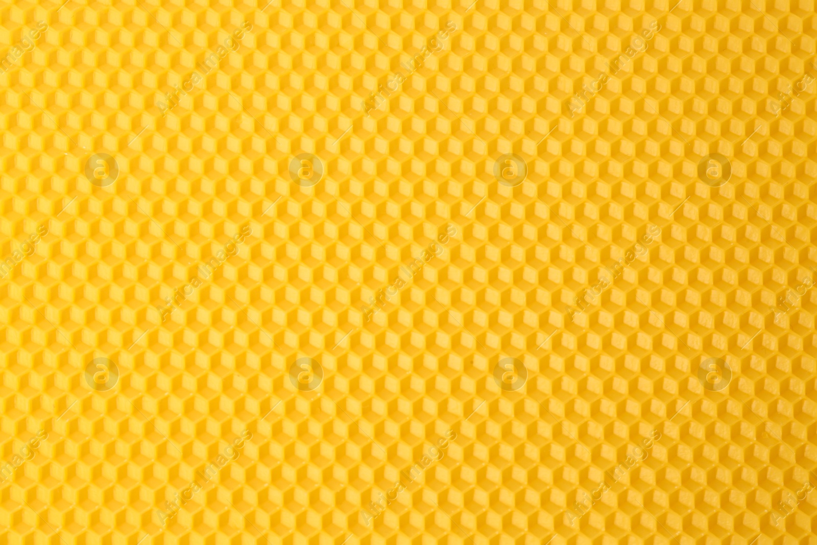 Photo of Natural beeswax sheet as background, top view