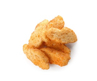 Pile of delicious crispy rusks on white background, top view