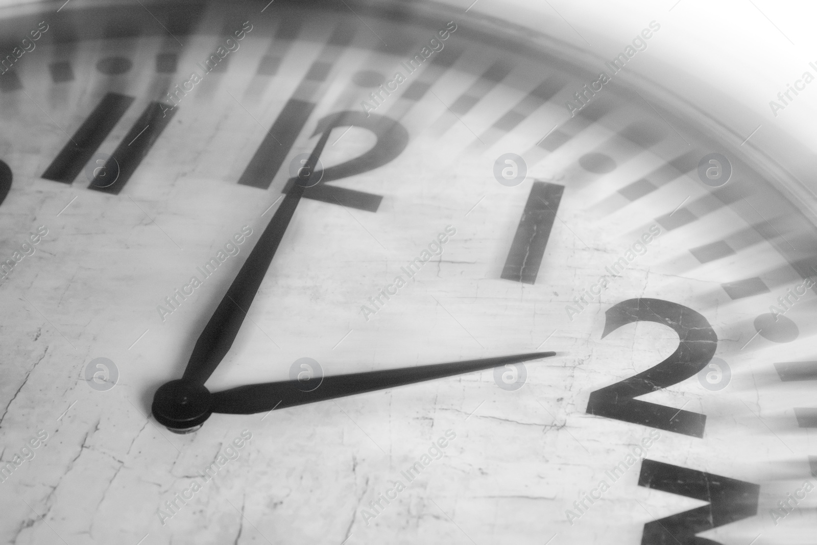 Image of Fleeting time concept. Clock on white background, closeup. Motion effect