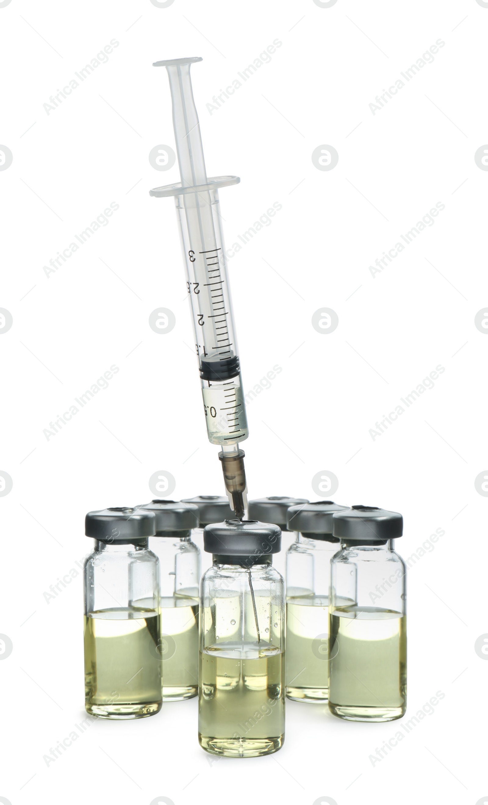 Photo of Syringe with vials of medicine on white background