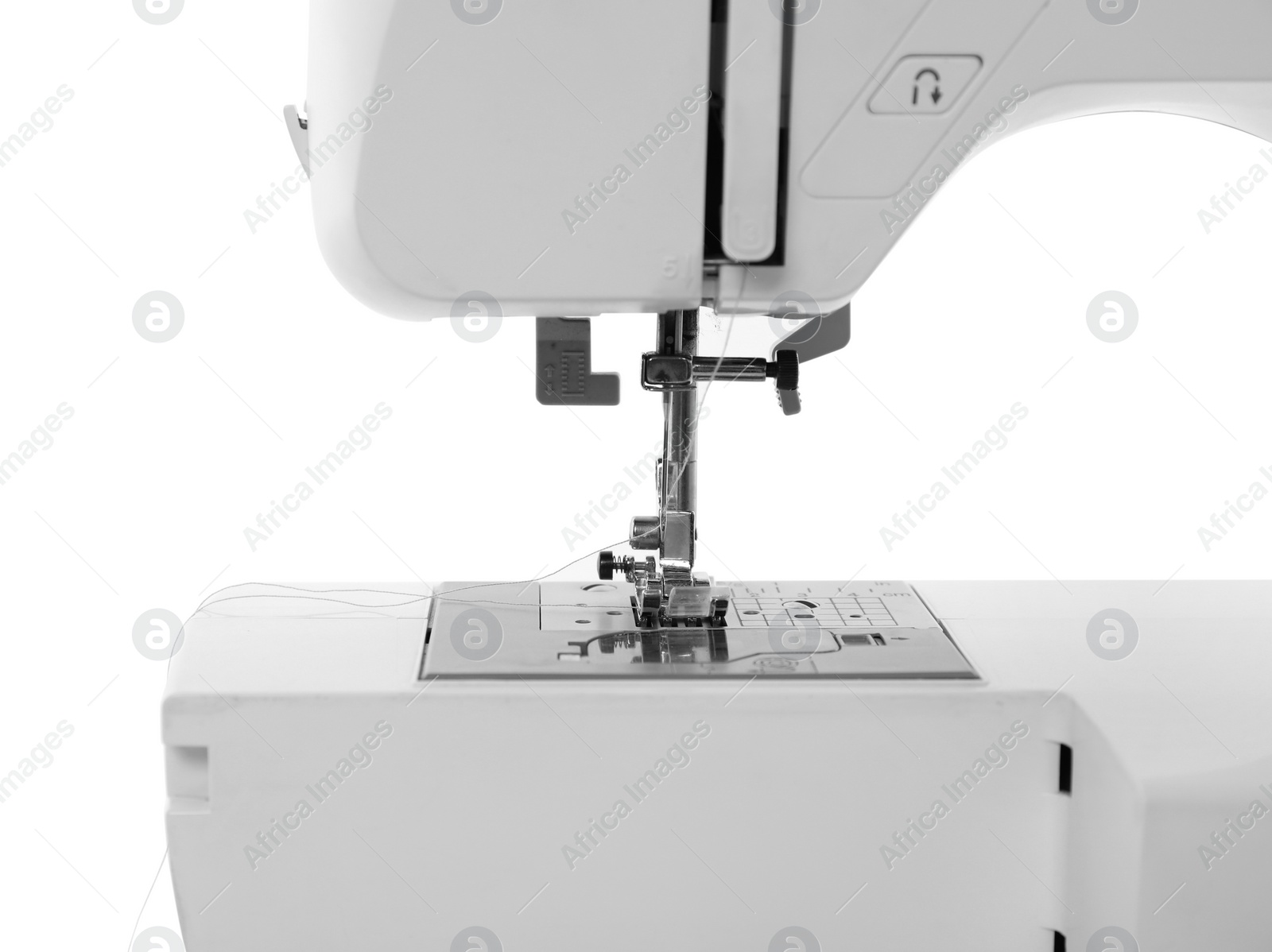 Photo of One modern sewing machine isolated on white