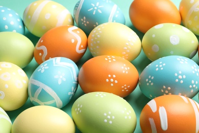 Many beautiful painted Easter eggs as background, closeup