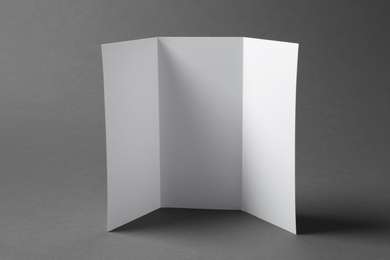 Photo of Blank brochure on gray background. Mock up for design