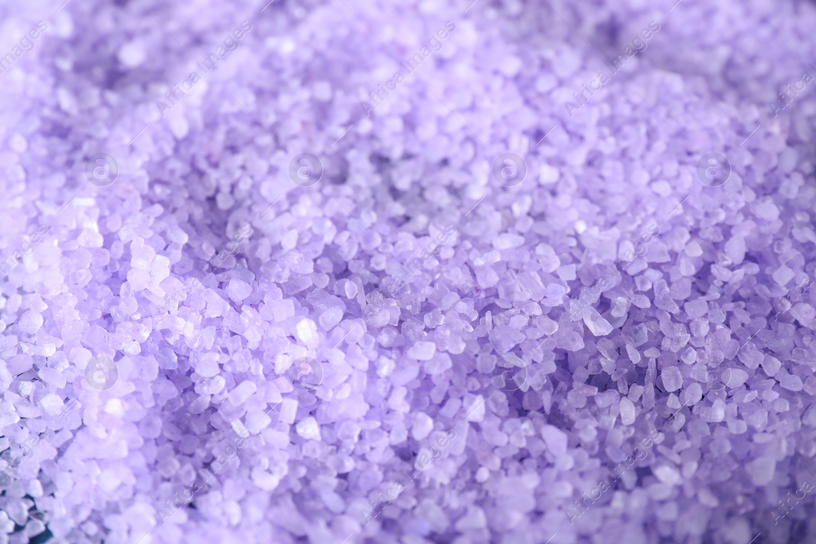 Photo of Lilac sea salt as background, closeup view