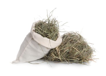 Dried hay in burlap sack isolated on white