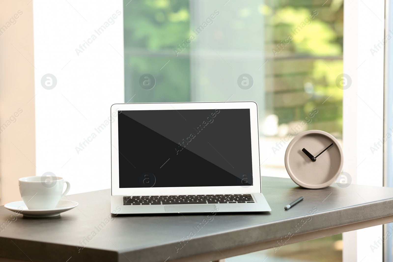 Image of Modern laptop on table indoors. Comfortable workplace 