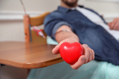 Man donating blood in hospital, closeup view