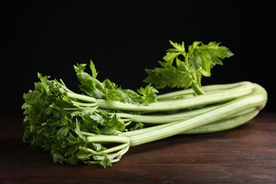 Fresh ripe green celery on wooden table