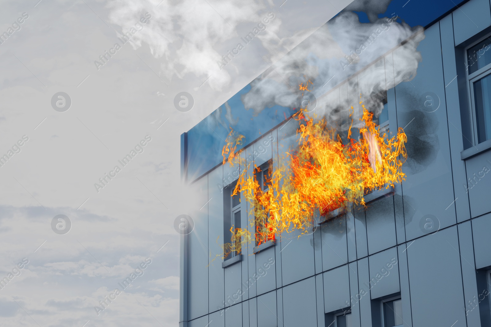 Image of Modern building engulfed in flames. Fire safety violations