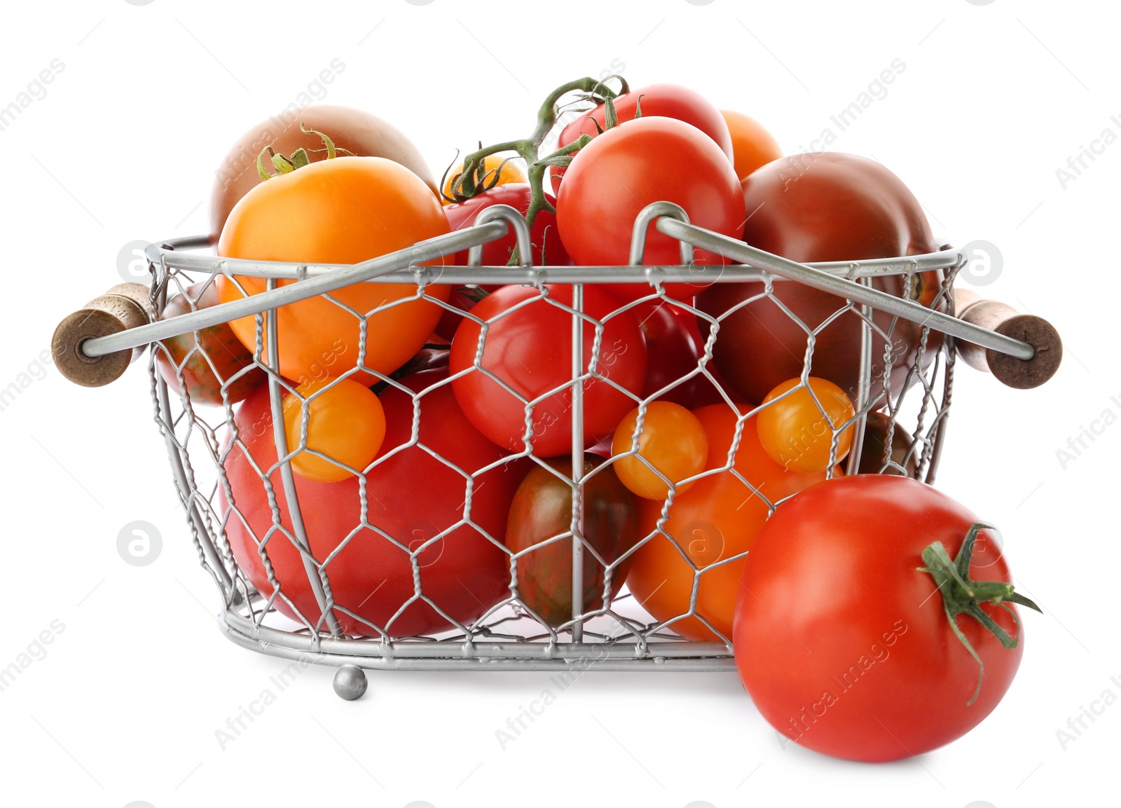 Photo of Fresh ripe yellow and red tomatoes in metal basket on white background