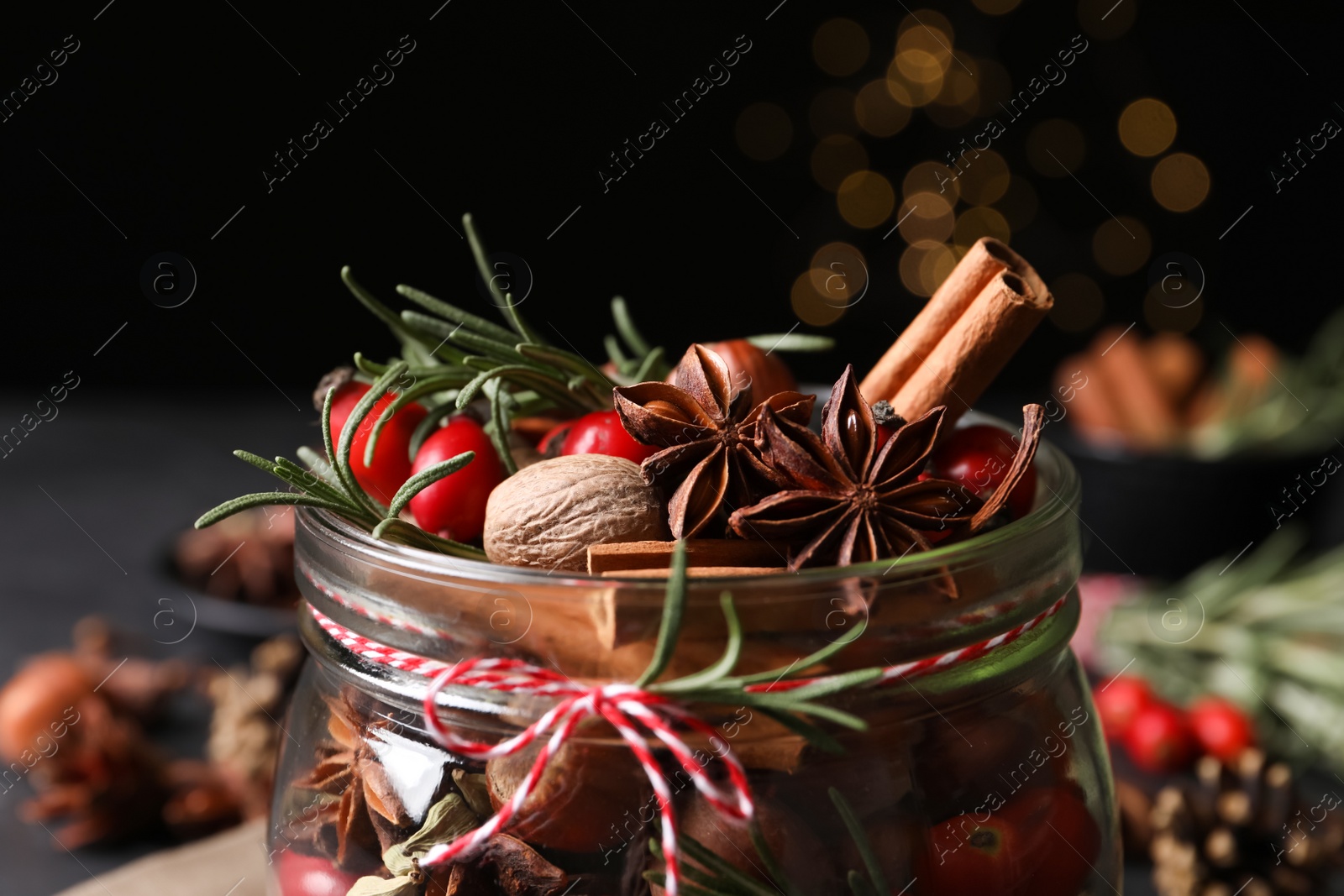 Photo of Aroma potpourri with different spices in jar, closeup view