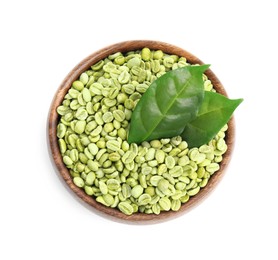 Wooden bowl with green coffee beans and fresh leaves on white background, top view