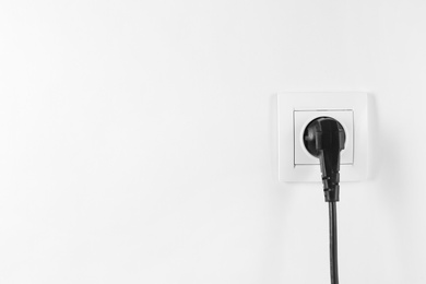 Power socket and plug on white background. Electrician's equipment