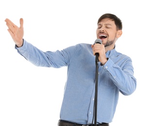 Photo of Handsome man singing in microphone on white background