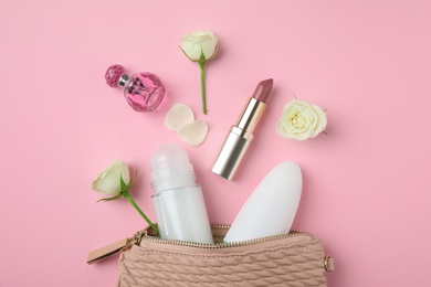 Photo of Flat lay composition with natural female deodorants and cosmetics on pink background