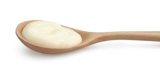 Fresh mayonnaise sauce in wooden spoon isolated on white