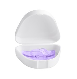 Container with transparent dental mouth guard isolated on white. Bite correction