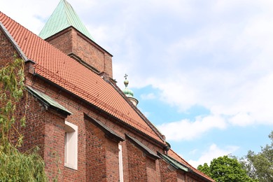 Photo of Beautiful church against blue sky, low angle view. Space for text