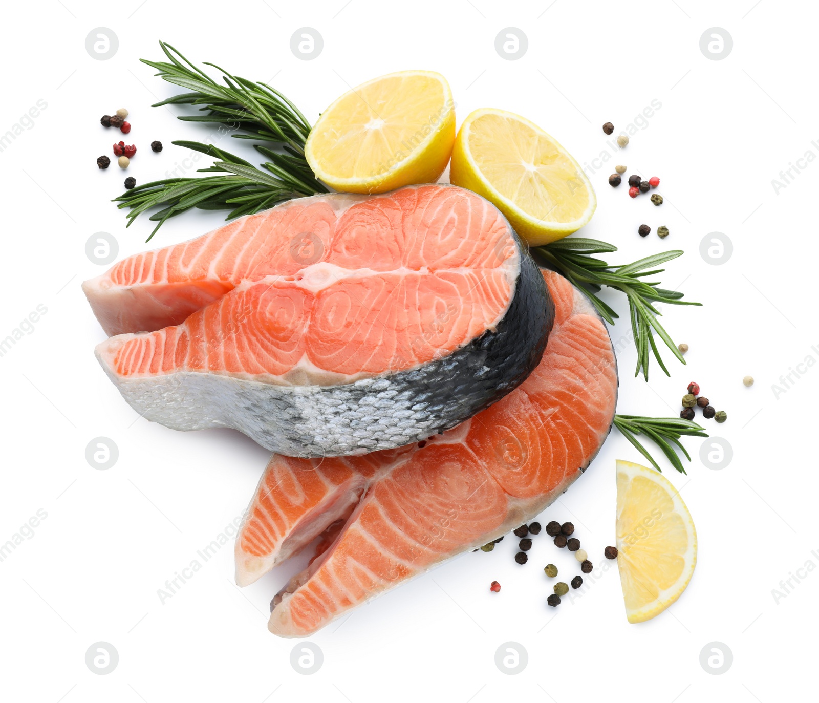 Photo of Fresh raw salmon steaks with rosemary, peppercorns and lemon on white background, top view