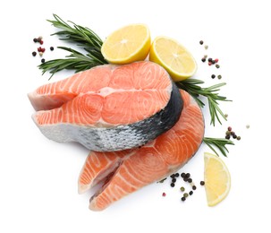 Photo of Fresh raw salmon steaks with rosemary, peppercorns and lemon on white background, top view