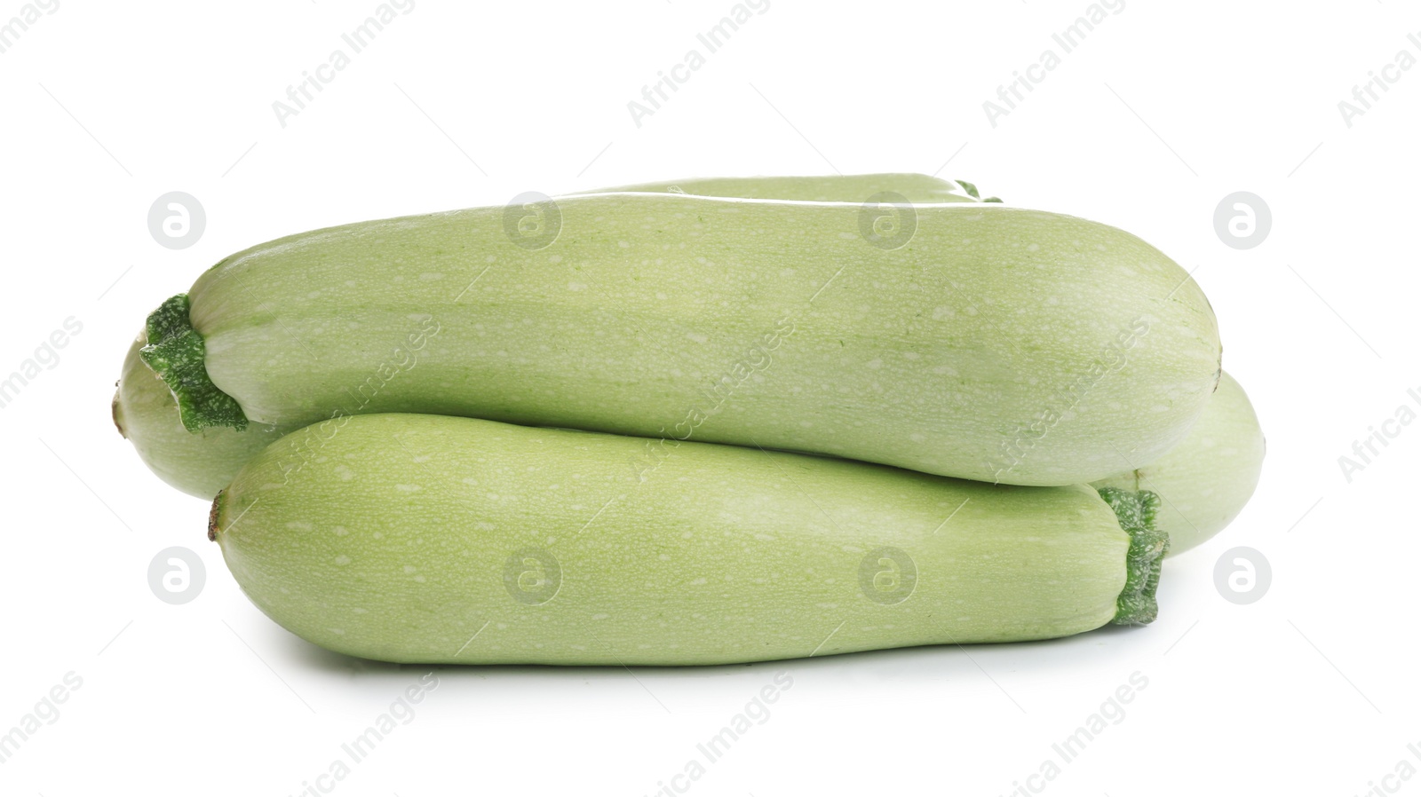 Photo of Fresh ripe green zucchinis isolated on white