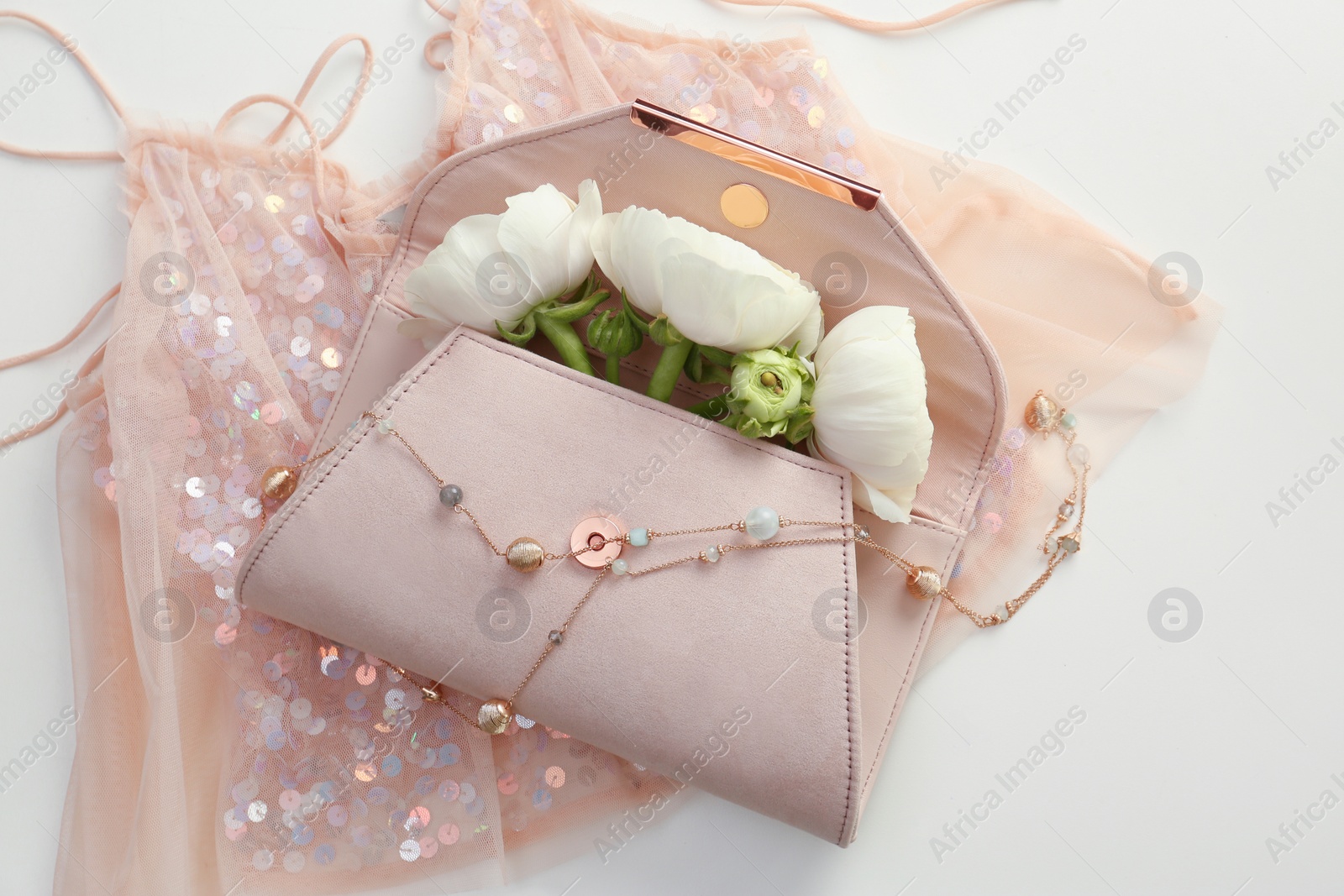 Photo of Flat lay composition with stylish clutch bag and spring flowers on light background