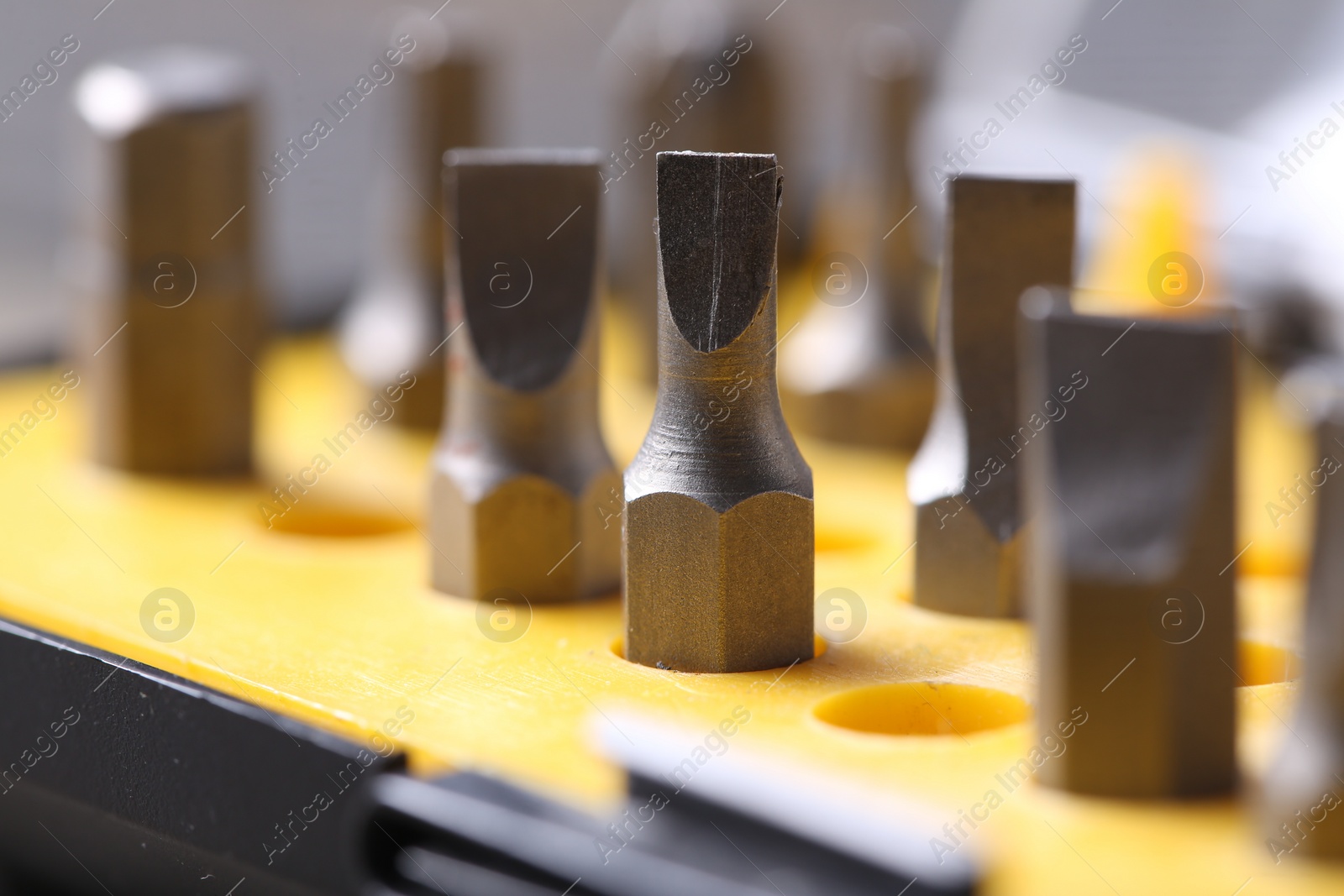 Photo of Screwdriver bit set on blurred background, closeup