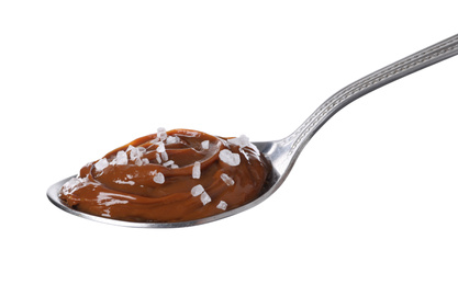 Photo of Salted caramel in spoon isolated on white