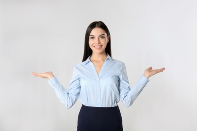 Portrait of young businesswoman on white background