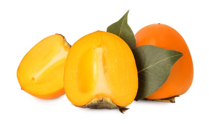 Photo of Whole and cut delicious ripe juicy persimmons on white background