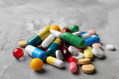 Heap of different pills on table, closeup