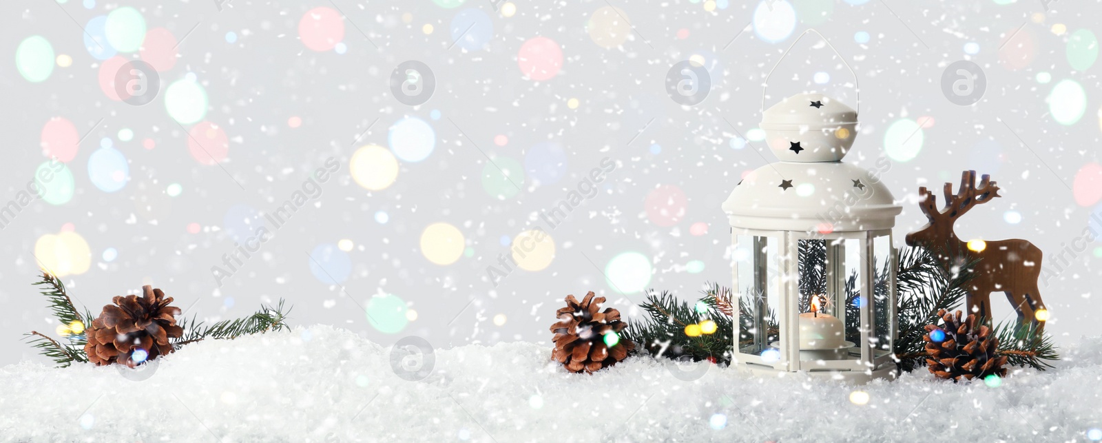 Image of Composition with Christmas lantern on snow, space for text. Bokeh effect