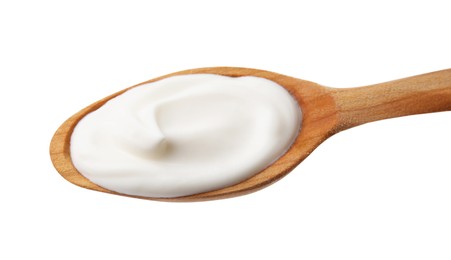 Wooden spoon with delicious sour cream isolated on white