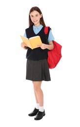 Photo of Full length portrait of teenage girl in school uniform with backpack and book on white background