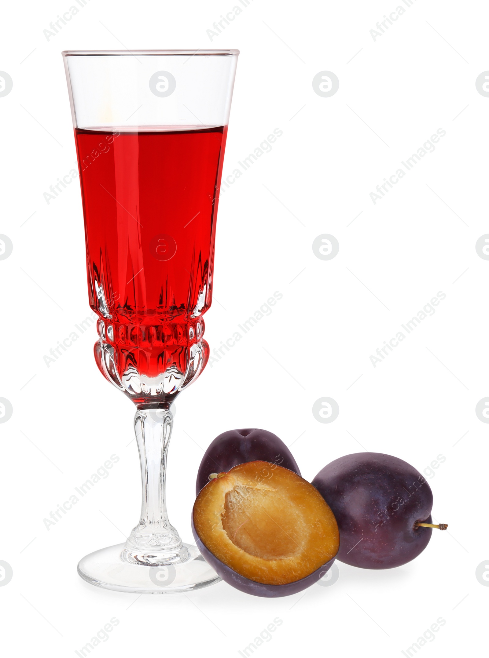 Photo of Delicious plum liquor and ripe fruits on white background. Homemade strong alcoholic beverage