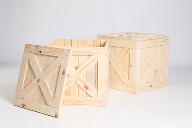 Photo of Pair of wooden crates on grey background