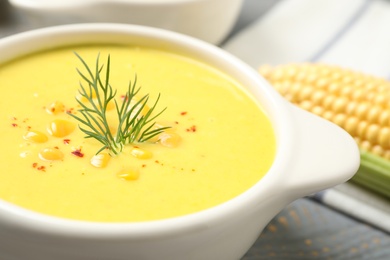 Photo of Delicious creamy corn soup on table, closeup