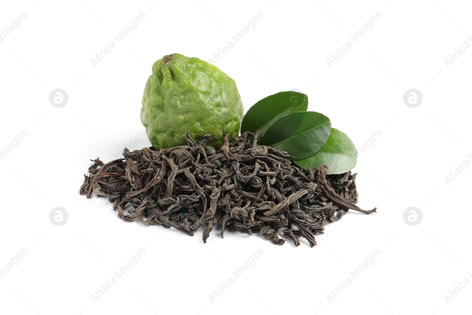 Photo of Pile of dry bergamot tea leaves and fresh fruit on white background