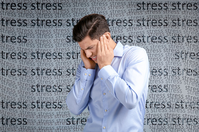 Image of Young man suffering from depression and words STRESS on grey background