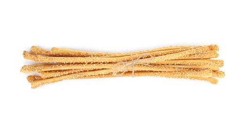 Fresh delicious grissini sticks on white background, top view