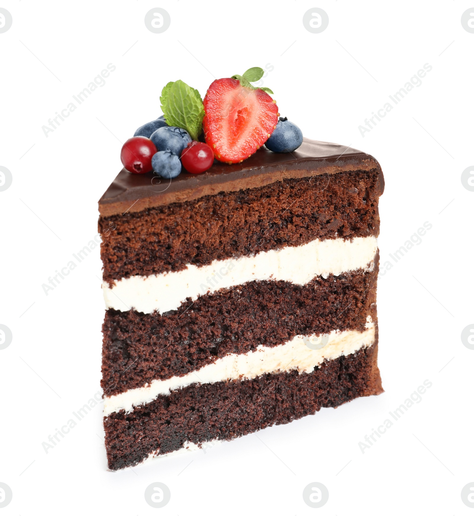 Photo of Slice of chocolate sponge cake with berries on white background