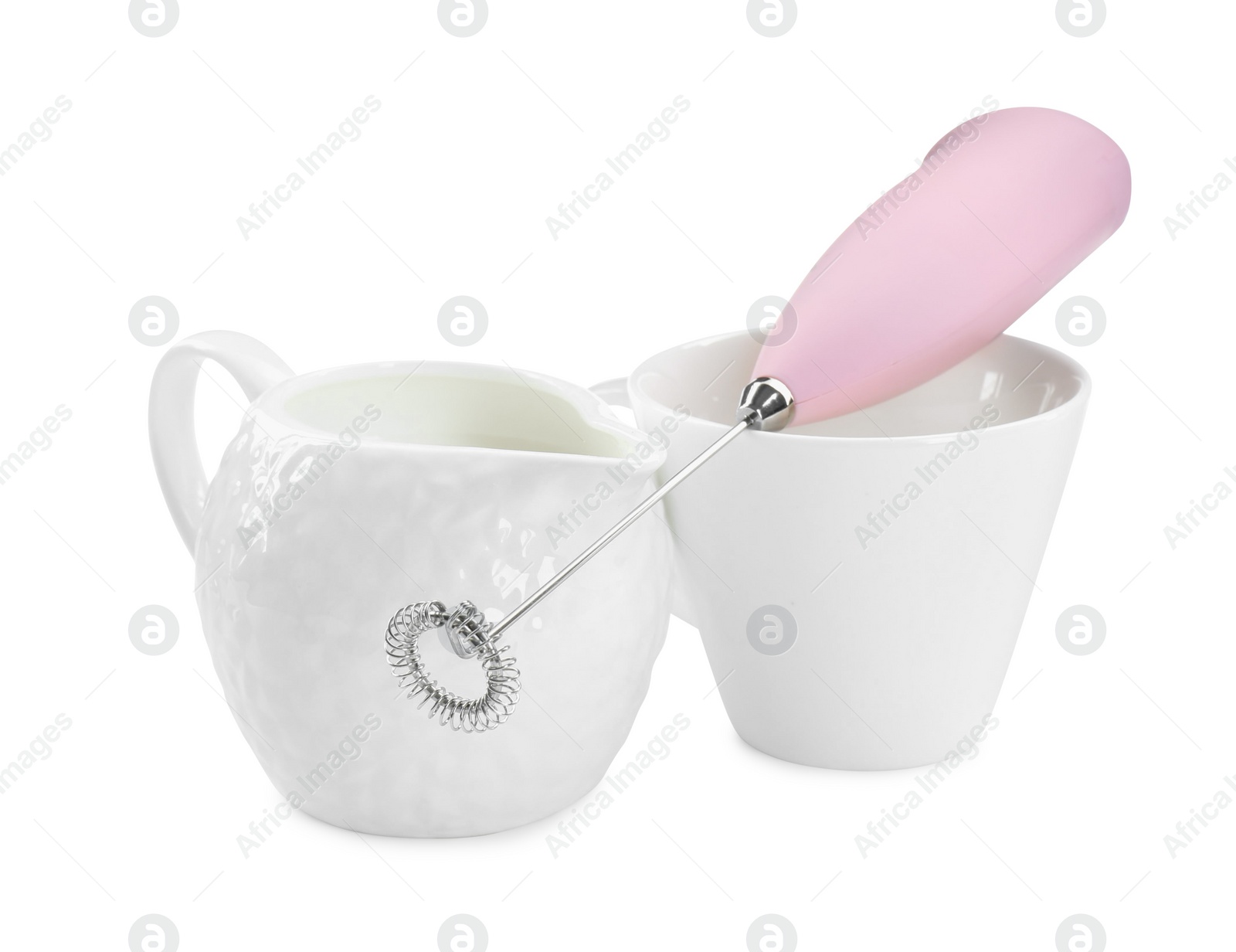 Photo of Milk frother wand, cup and pitcher isolated on white