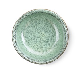 Beautiful green ceramic bowl on white background, top view