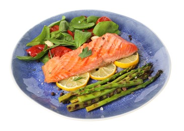 Photo of Tasty grilled salmon with tomatoes, asparagus, spinach and lemon isolated on white