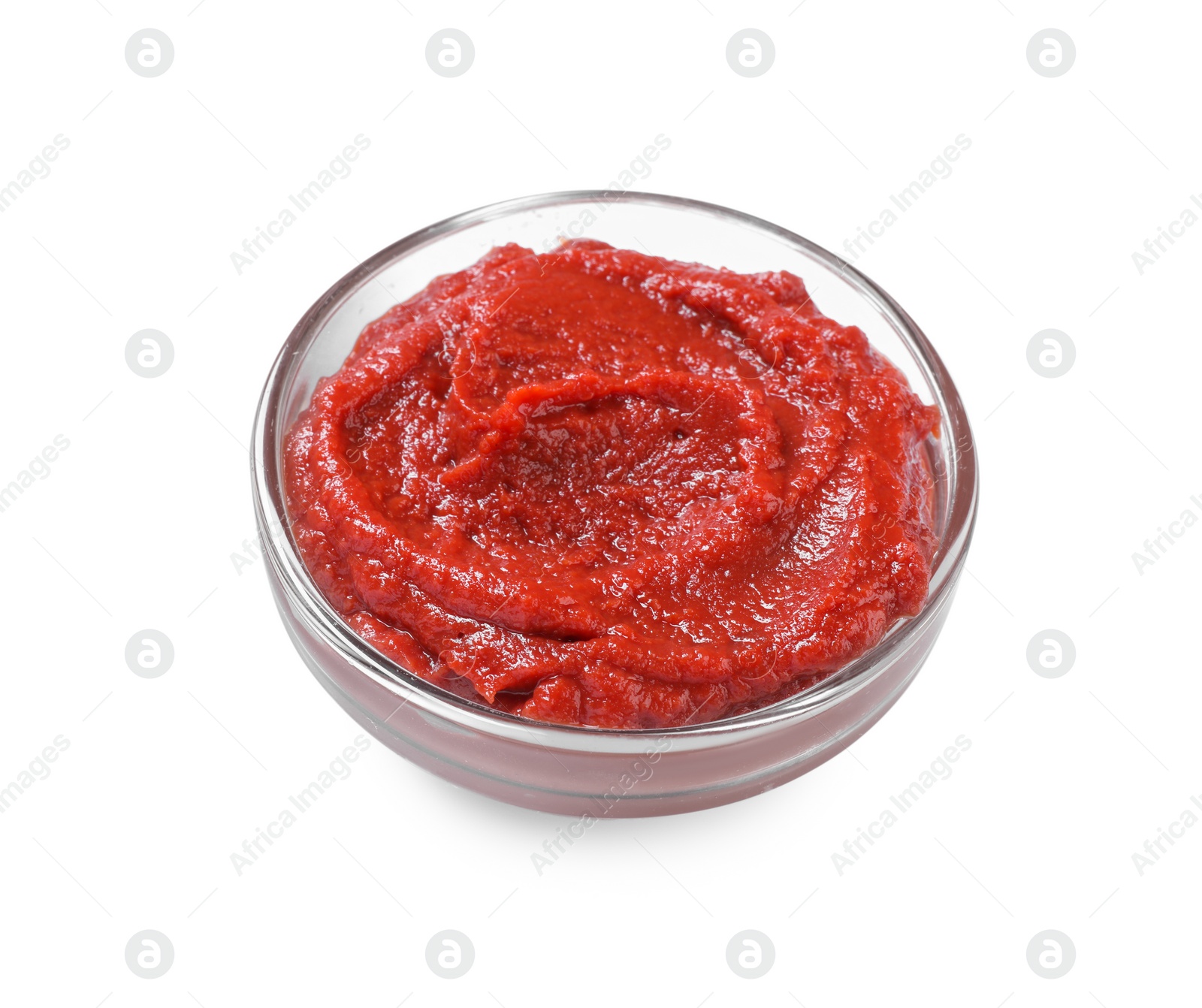 Photo of Glass bowl of tasty tomato paste isolated on white