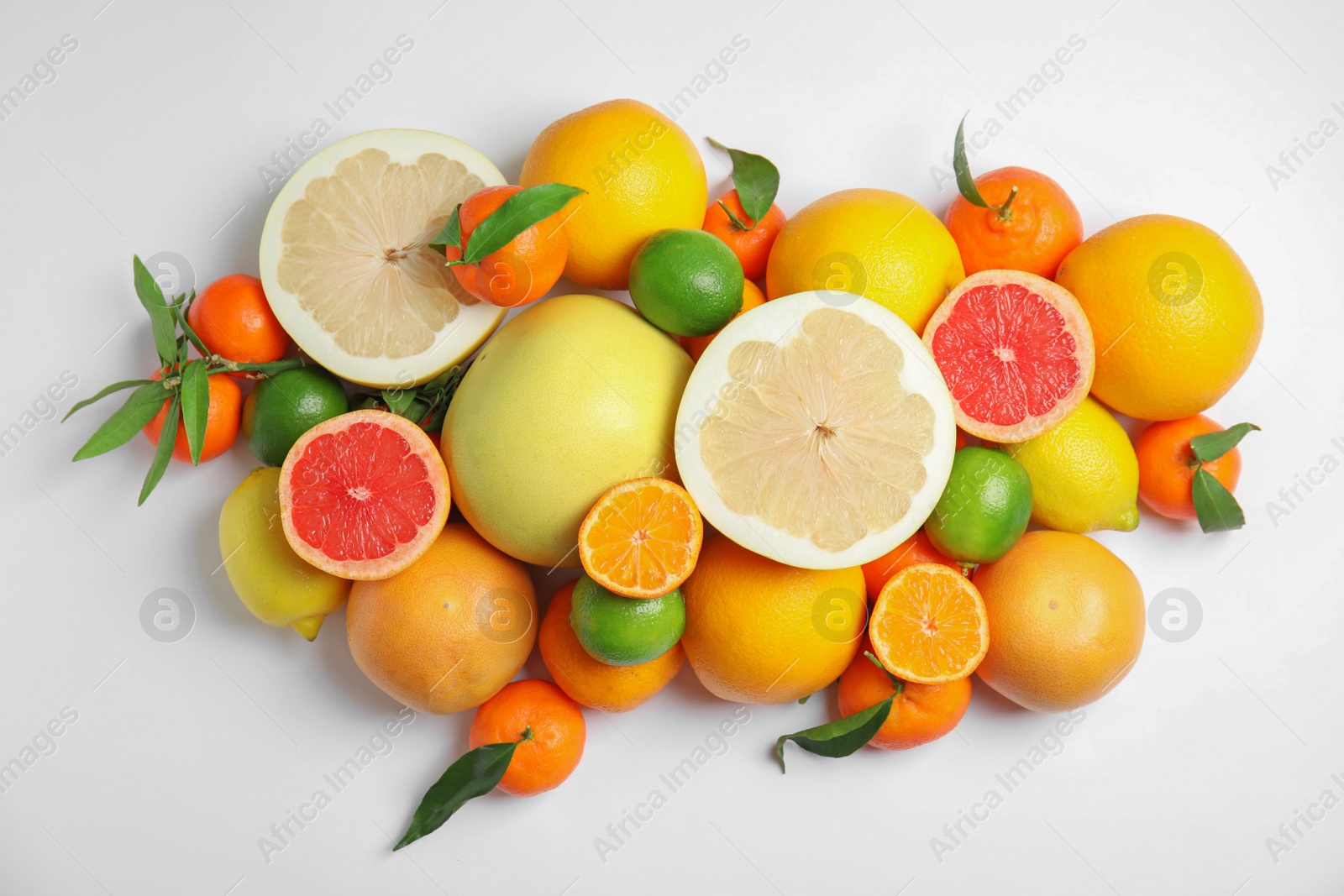 Photo of Different citrus fruits on white background, top view