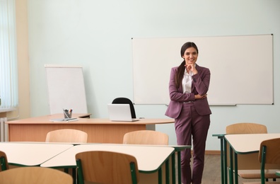 Photo of Portrait of female teacher in modern classroom