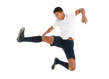 Photo of Teenage African-American boy playing football on white background