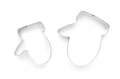 Photo of Mitten shaped cookie cutters on white background, top view