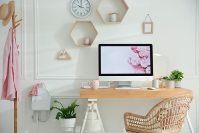 Photo of Stylish home office interior with comfortable workplace